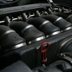 BMW E30 S50 inline-six with an individual throttle body (ITB) conversion, close-up of the six velocity stacks