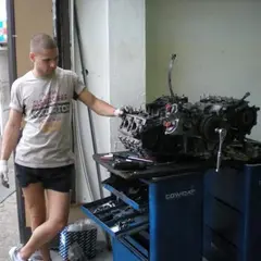 Air-cooled Porsche 911 flat-six engine removed on a workshop stand during a rebuild